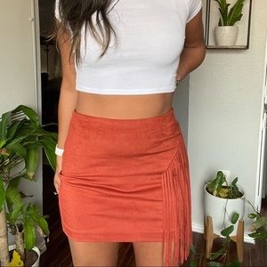 Orange fringe mini skirt